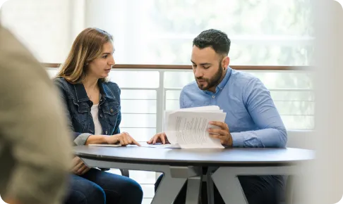 Woman and man working with documents.